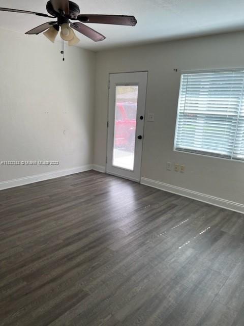 3524 Eagle Drive Orlando, FL 32804 - Photo 6 of 7 an empty room with wooden floor fan and windows