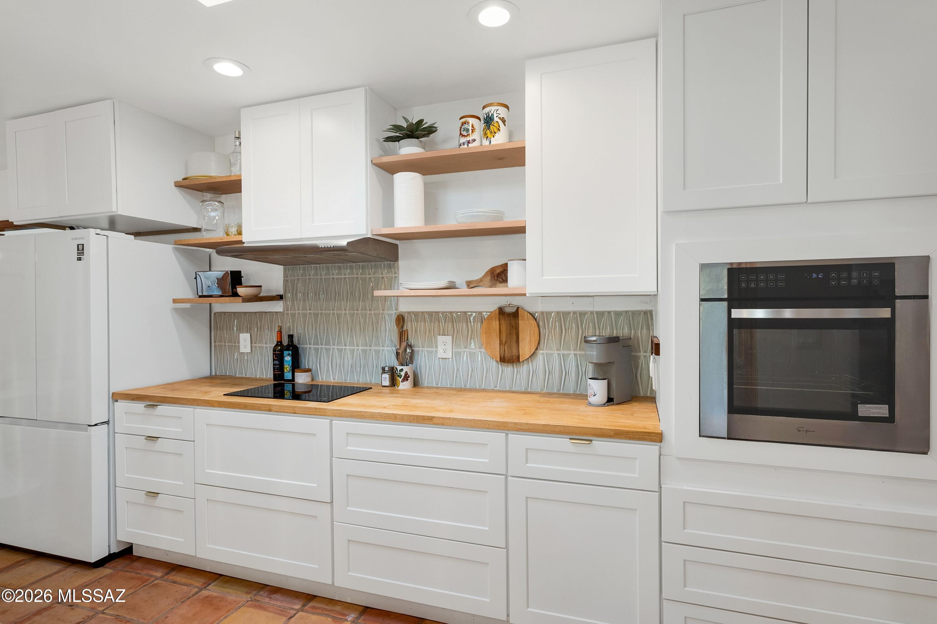 6941 East Rivercrest Road Tucson, AZ 85750 - Photo 3 of 32 a kitchen with a sink and cabinets