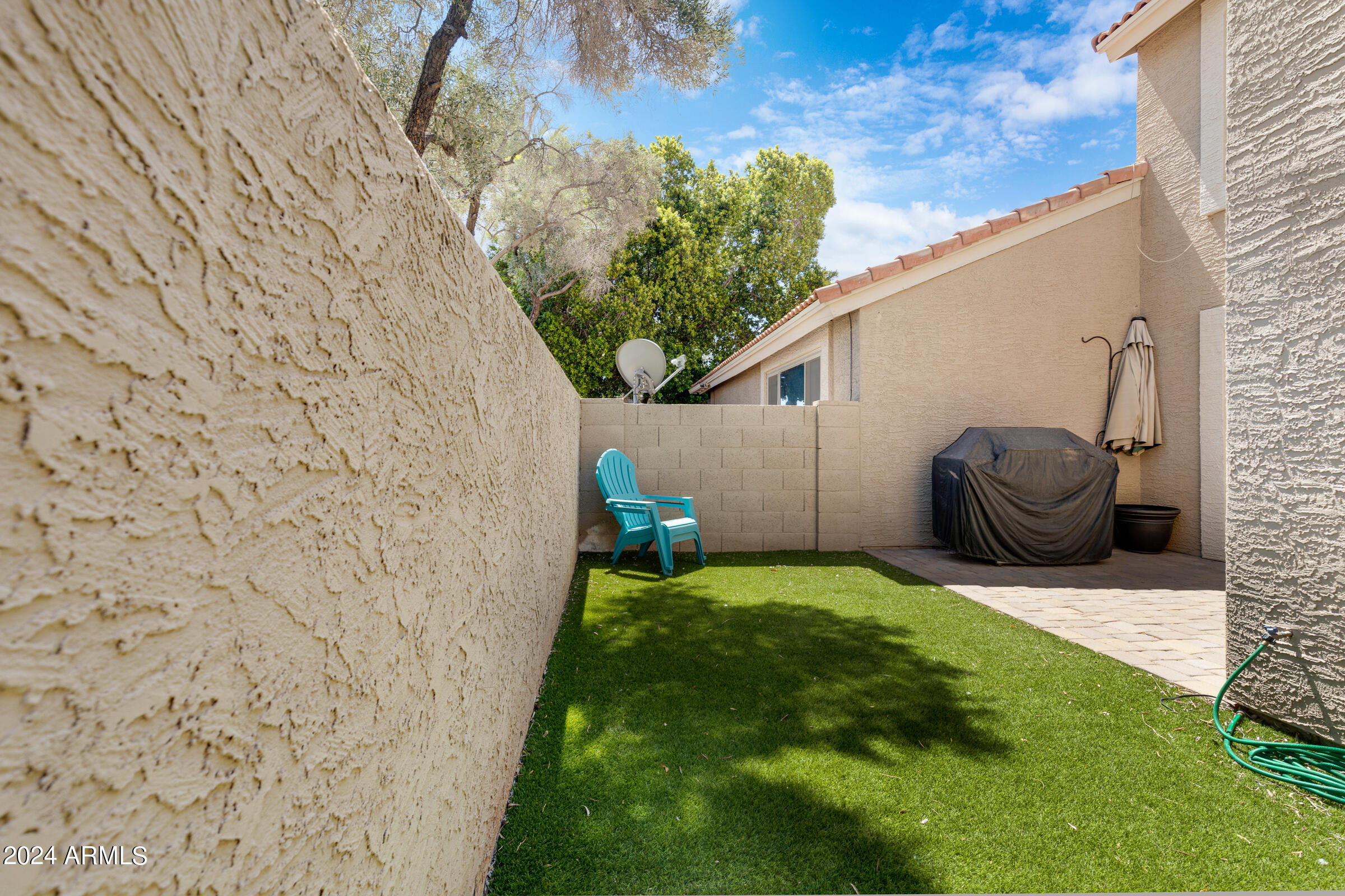 4142 East Agave Road Phoenix, AZ 85044 - Photo 29 of 30 a view of a backyard with furniture