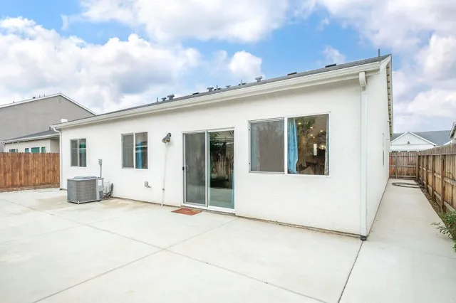 a view of a house with basketball court