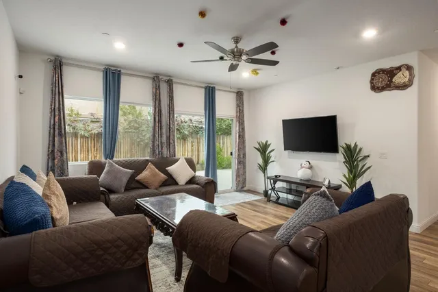 a living room with furniture and a flat screen tv