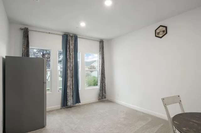 a view of livingroom with furniture and windows