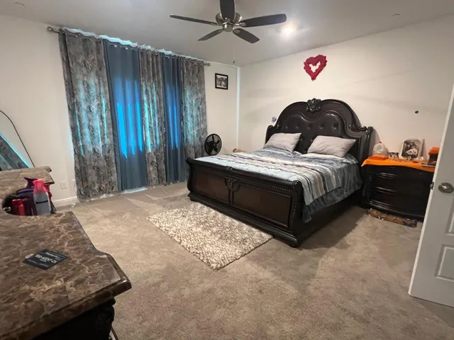 a bedroom with a bed and a dresser