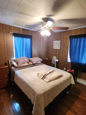 a bedroom with a bed and a table