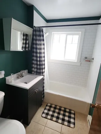 a bathroom with a sink and a bathtub