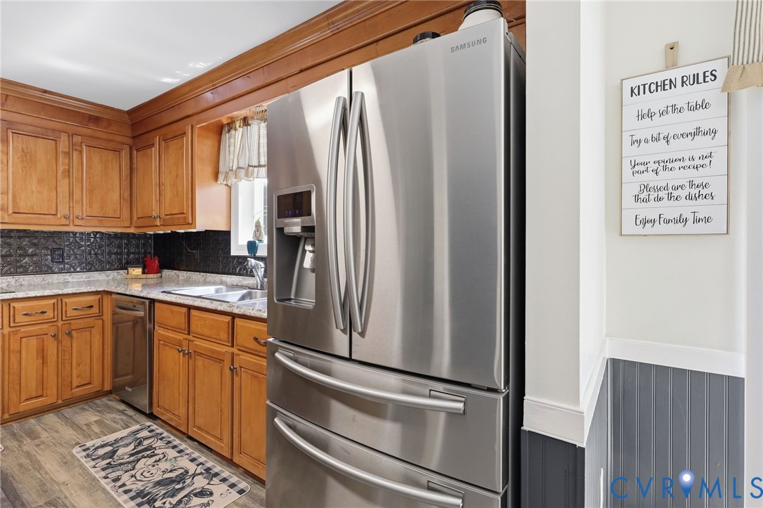 11200 Surry Road Chester, VA 23831 - Photo 17 of 48 a kitchen with stainless steel appliances a refrigerator and a sink