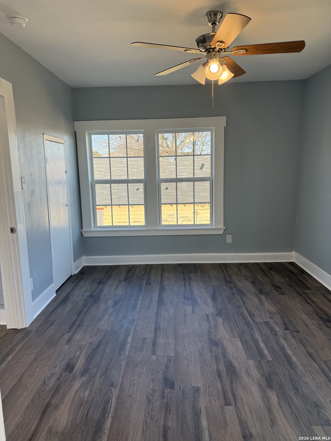 917 South 4th Street Temple, TX 76504 - Photo 13 of 33 wooden floor in an empty room with a window