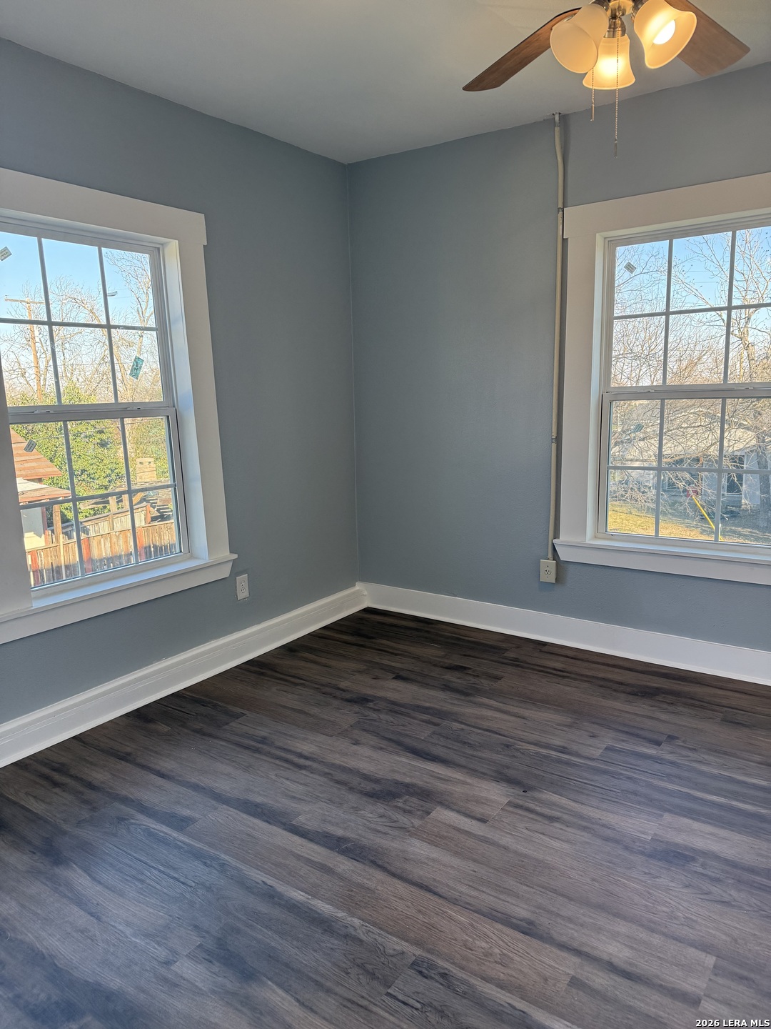 917 South 4th Street Temple, TX 76504 - Photo 16 of 33 a view of an empty room with wooden floor and a window
