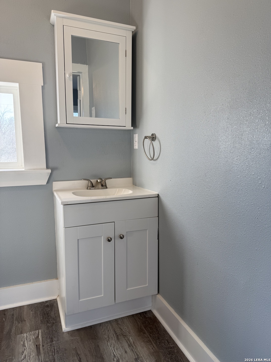 917 South 4th Street Temple, TX 76504 - Photo 17 of 33 a bathroom with a sink vanity and a mirror