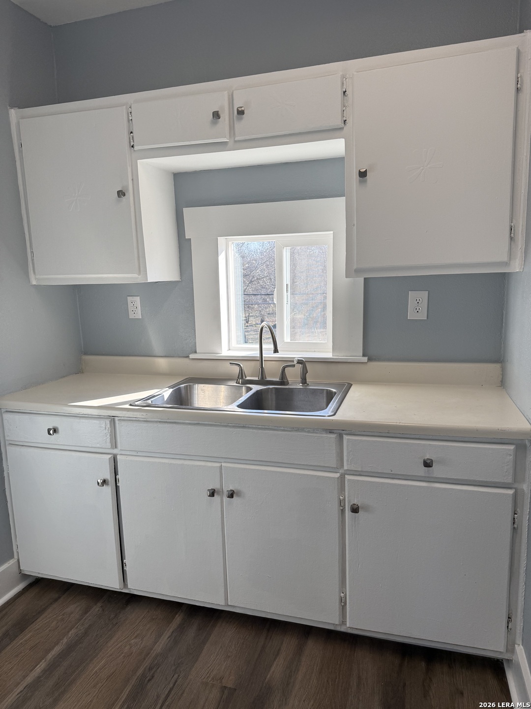 917 South 4th Street Temple, TX 76504 - Photo 18 of 33 a kitchen with a sink and cabinets