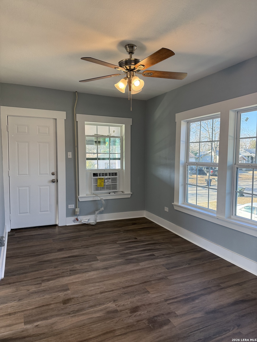 917 South 4th Street Temple, TX 76504 - Photo 22 of 33 a view of an empty room with wooden floor and a window