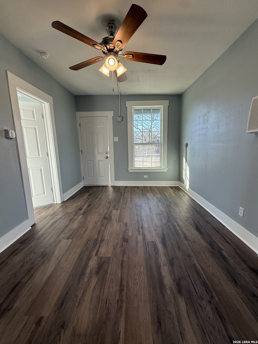 917 South 4th Street Temple, TX 76504 - Photo 30 of 33 wooden floor in an empty room with a window