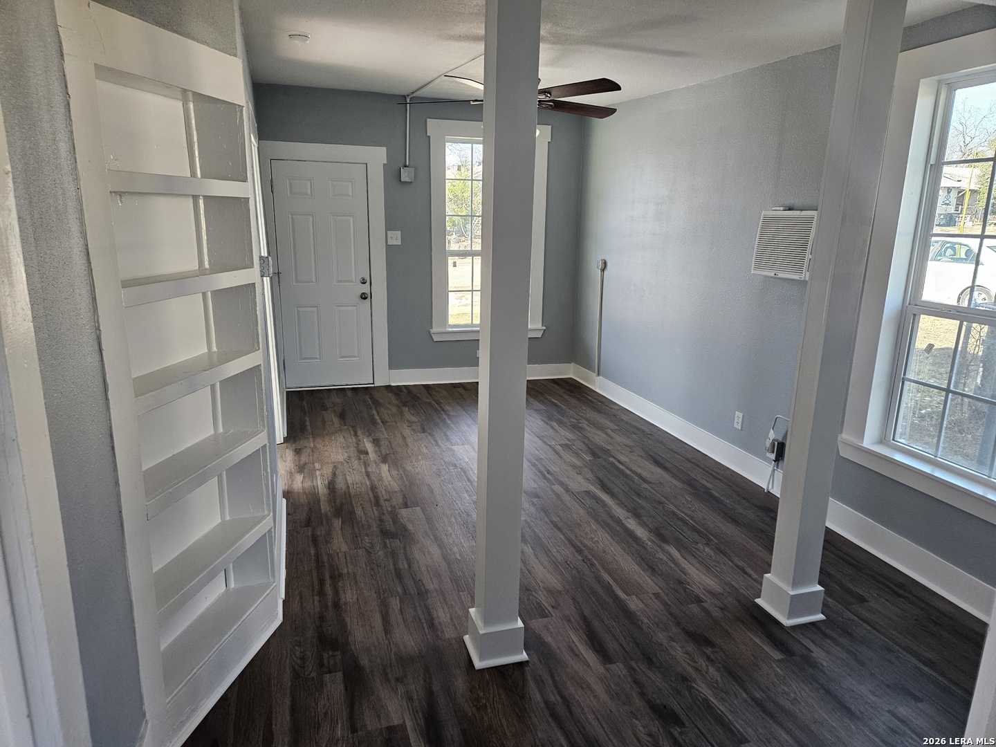 917 South 4th Street Temple, TX 76504 - Photo 4 of 33 wooden floor in an empty room with a window