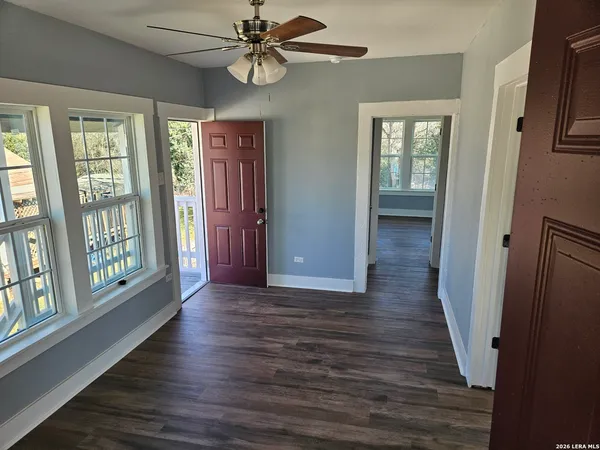 wooden floor in an empty room with a window