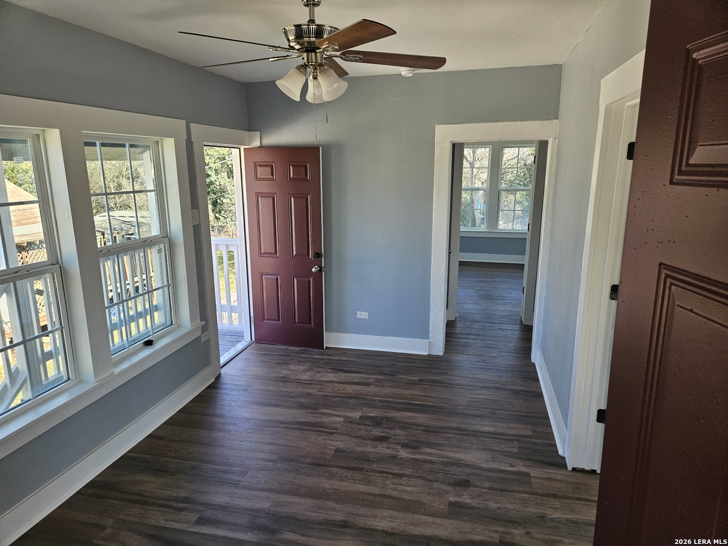 917 South 4th Street Temple, TX 76504 - Photo 7 of 33 wooden floor in an empty room with a window