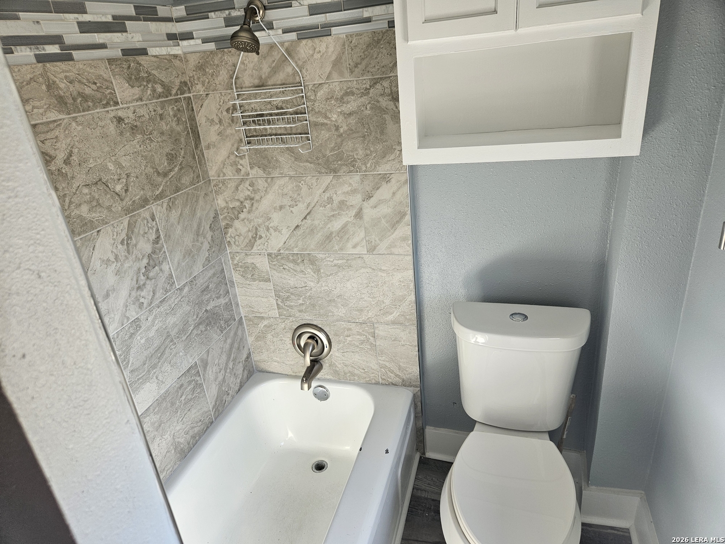 917 South 4th Street Temple, TX 76504 - Photo 8 of 33 a bathroom with a toilet sink and mirror