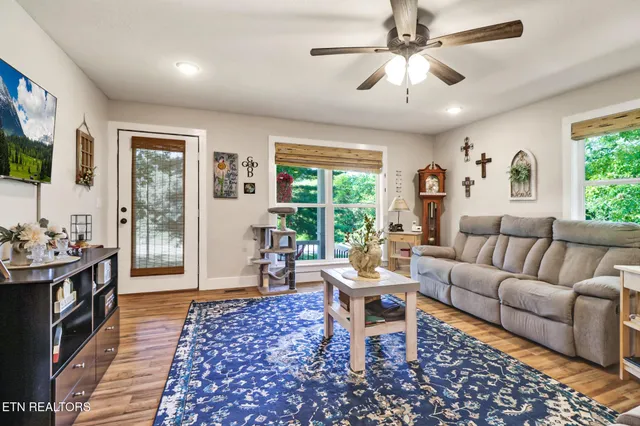 a living room with furniture and a window