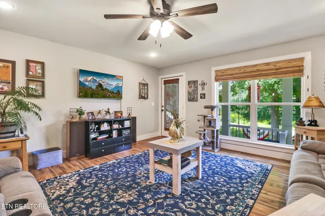 a living room with furniture and a flat screen tv