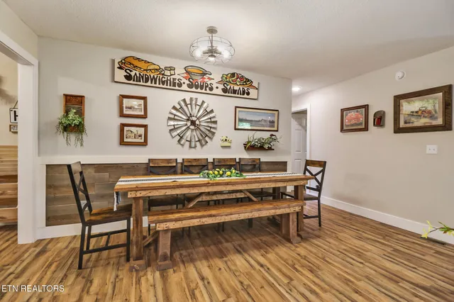 a view of a work space with furniture and wooden floor