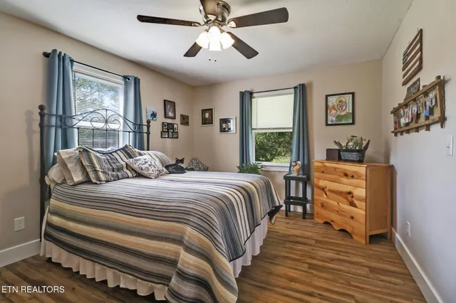 a bed room with a bed and a window