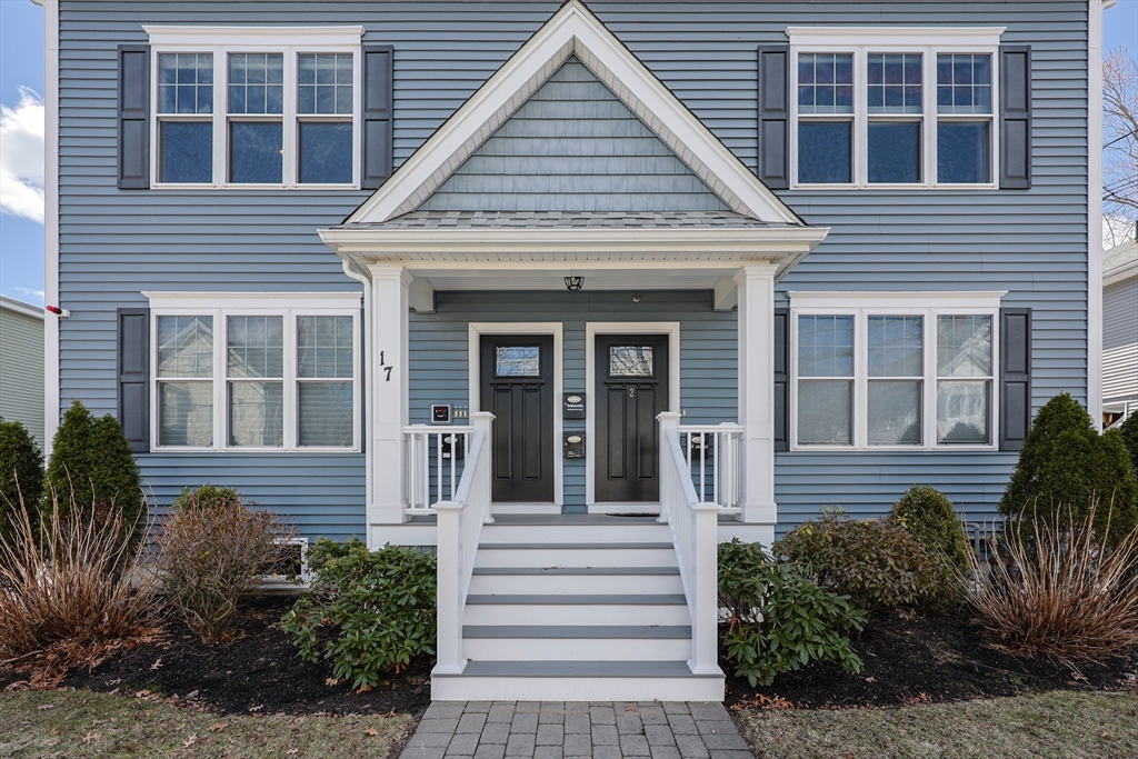17 Washington Avenue, Unit 3 Waltham, MA 02453 - Photo 2 of 38 a view of a house with small yard plants and large tree