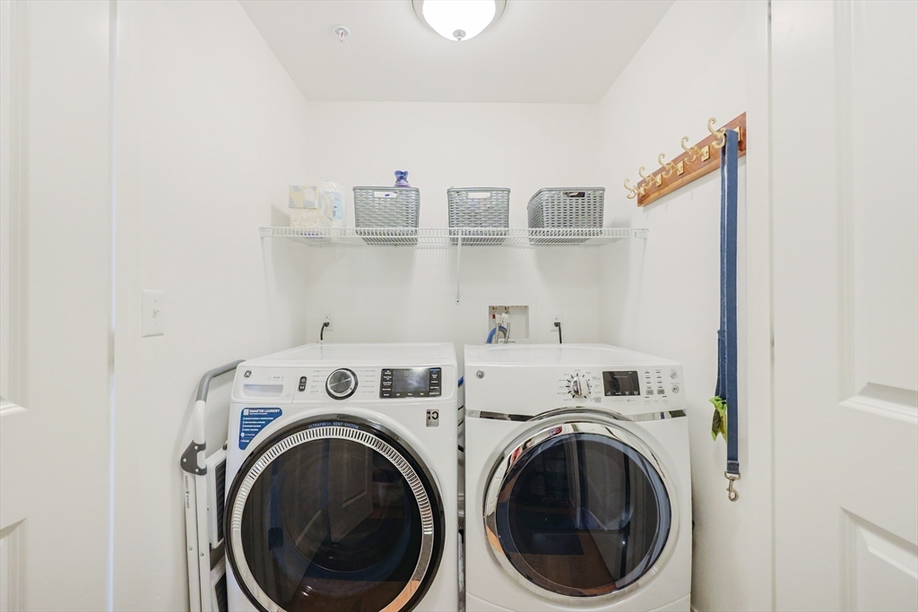 17 Washington Avenue, Unit 3 Waltham, MA 02453 - Photo 25 of 38 a view of washer and dryer with kitchen in the background