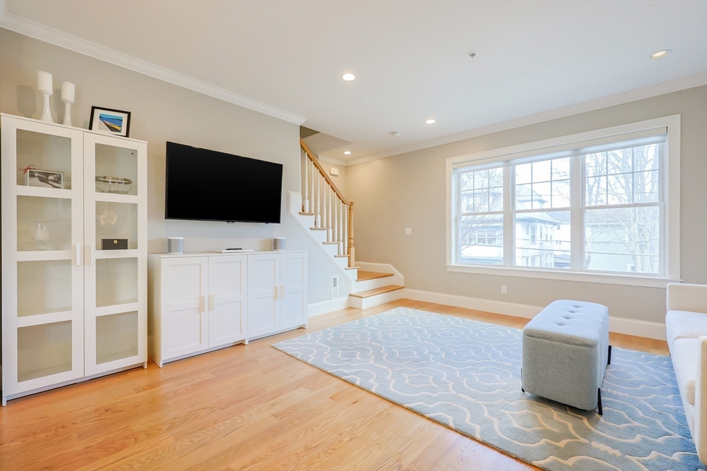 17 Washington Avenue, Unit 3 Waltham, MA 02453 - Photo 8 of 38 a living room with furniture and a flat screen tv