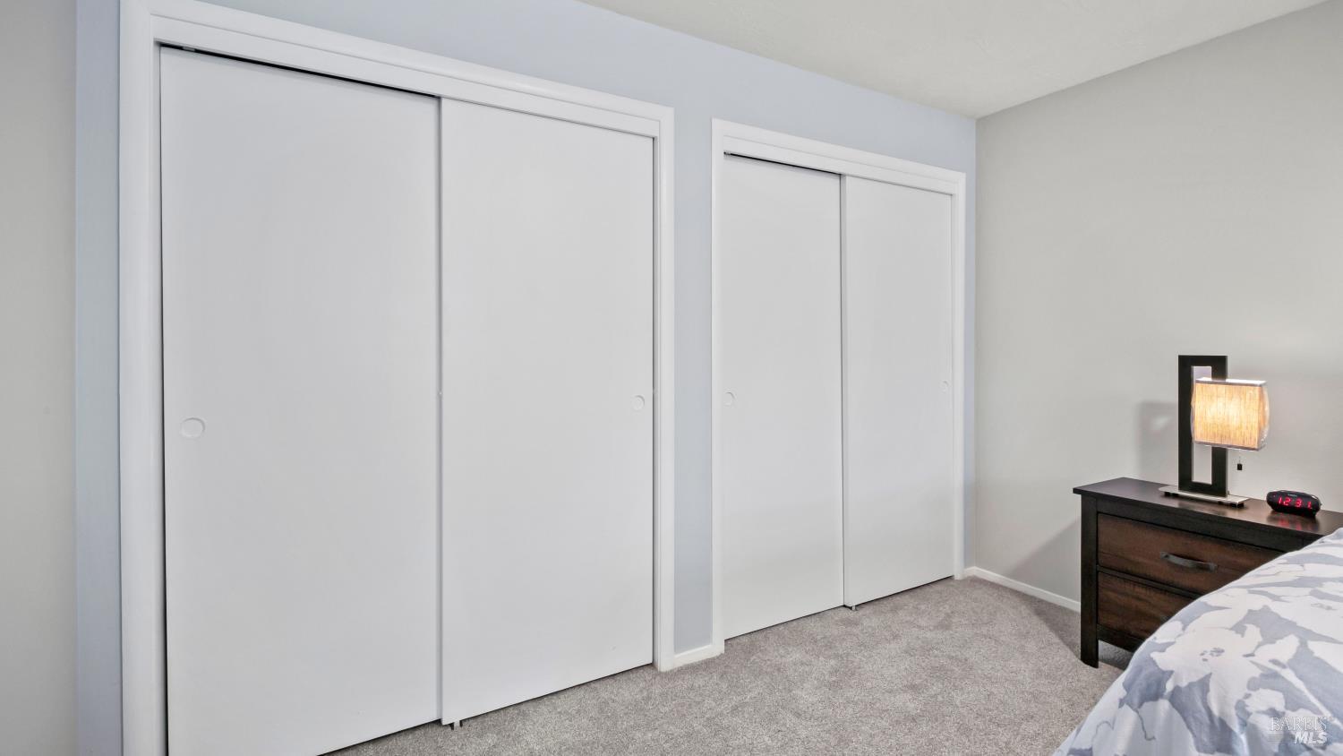 7 Portola Court Santa Rosa, CA 95409 - Photo 19 of 39 a bedroom with a bed and a night stand