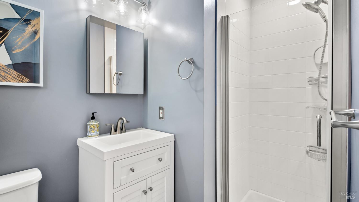 7 Portola Court Santa Rosa, CA 95409 - Photo 22 of 39 a bathroom with a sink and a mirror