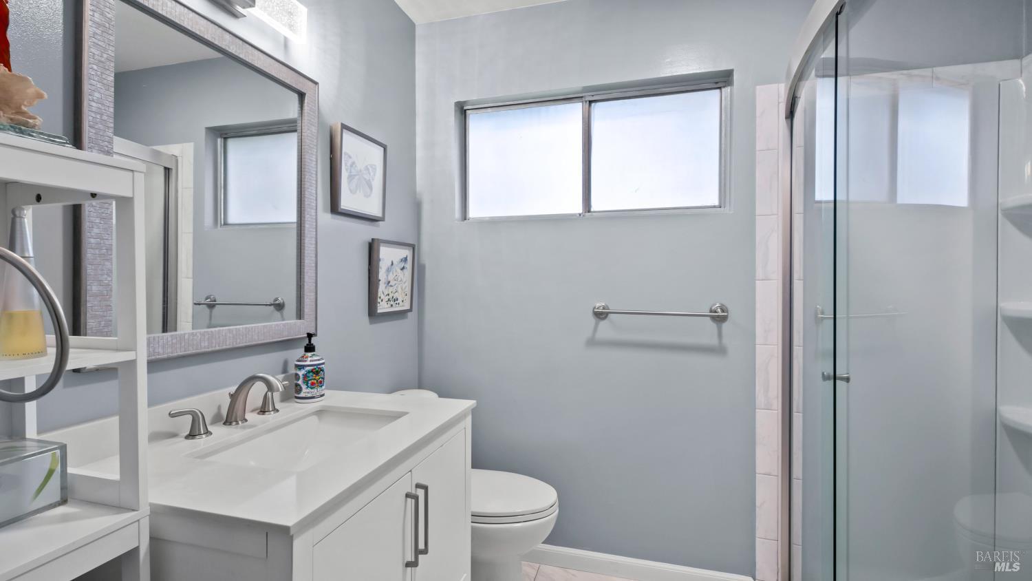 7 Portola Court Santa Rosa, CA 95409 - Photo 25 of 39 a bathroom with a sink toilet and vanity