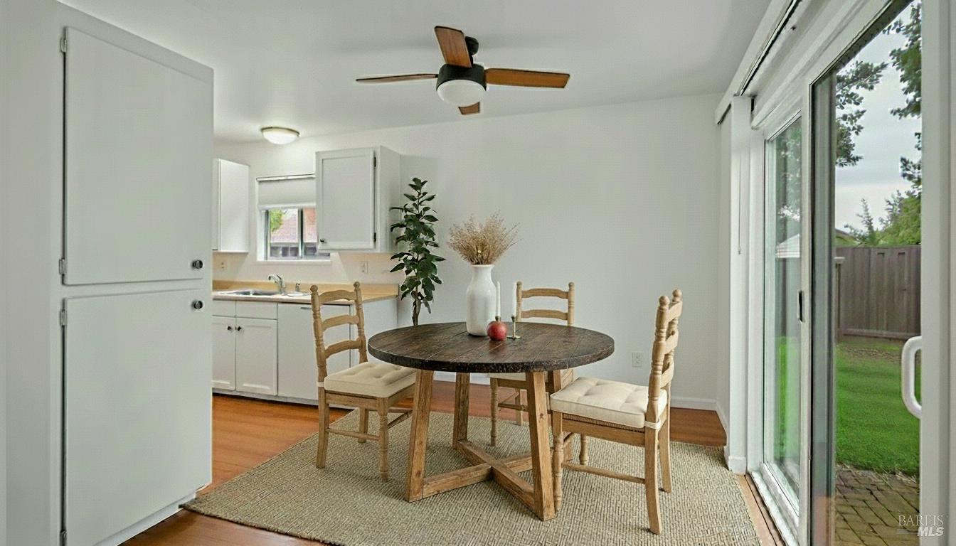 7 Portola Court Santa Rosa, CA 95409 - Photo 34 of 39 a dining room with furniture and a chandelier