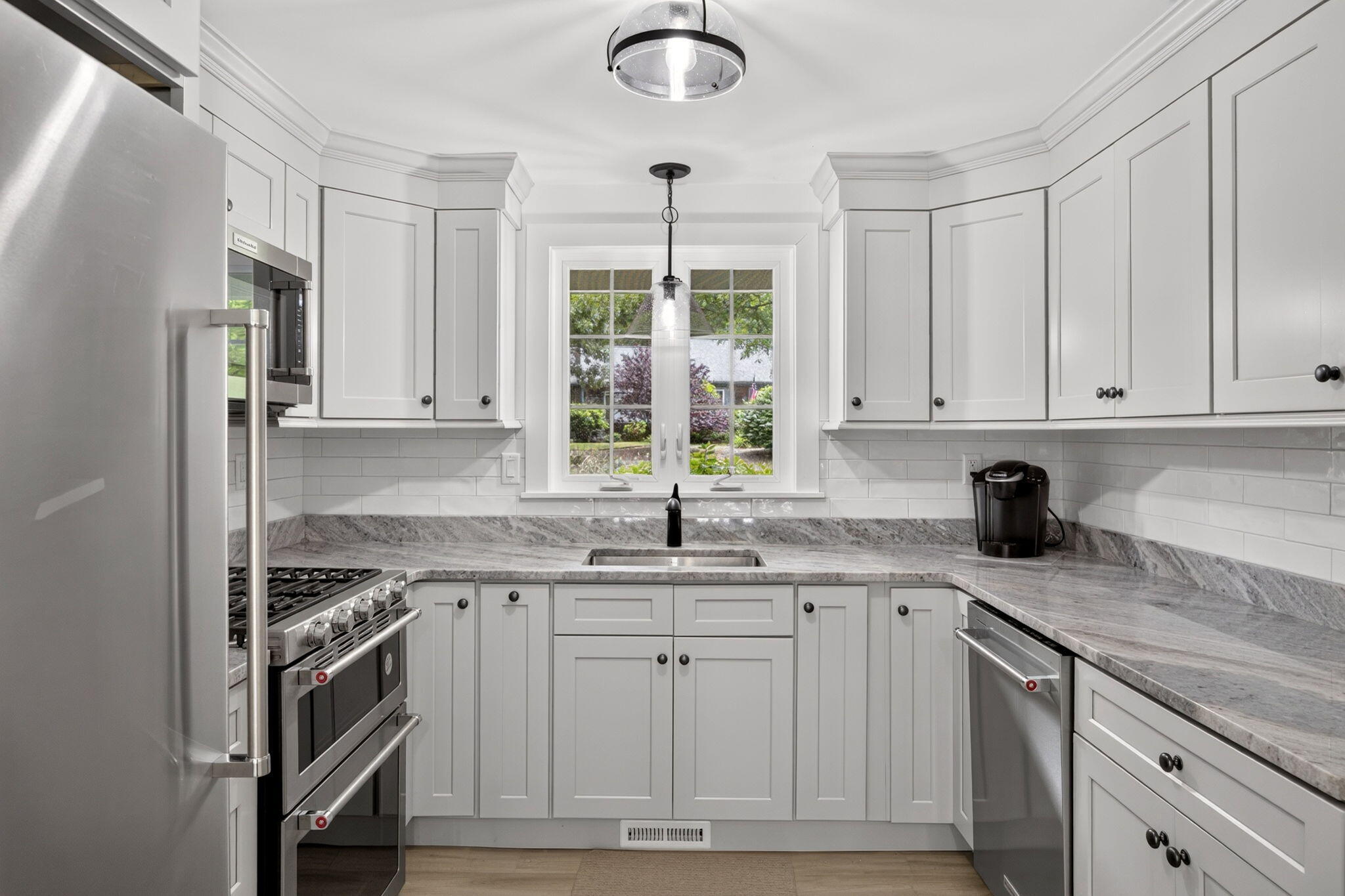 35 Debs Hill Road, Unit 35 Yarmouth Port, MA 02675 - Photo 24 of 36 a kitchen with stainless steel appliances granite countertop a sink cabinets and a window