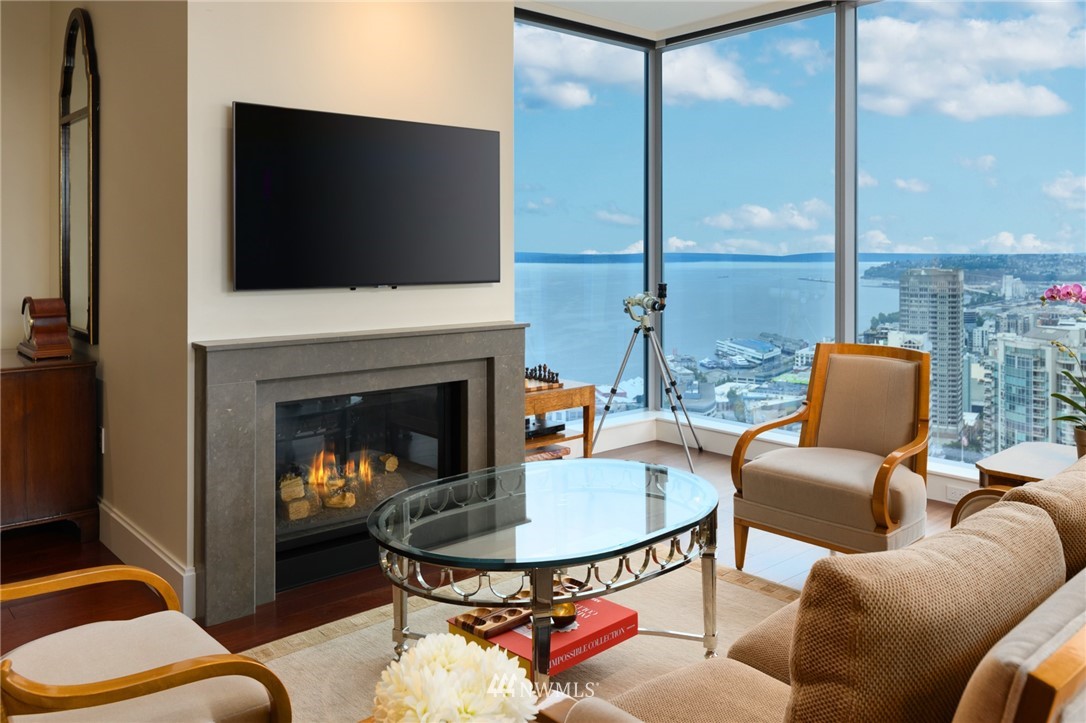 a living room with furniture fireplace and a flat screen tv