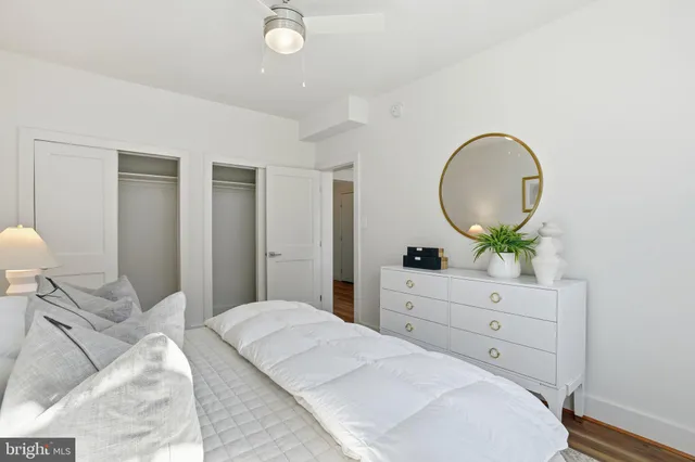 a bedroom with a bed and a dresser