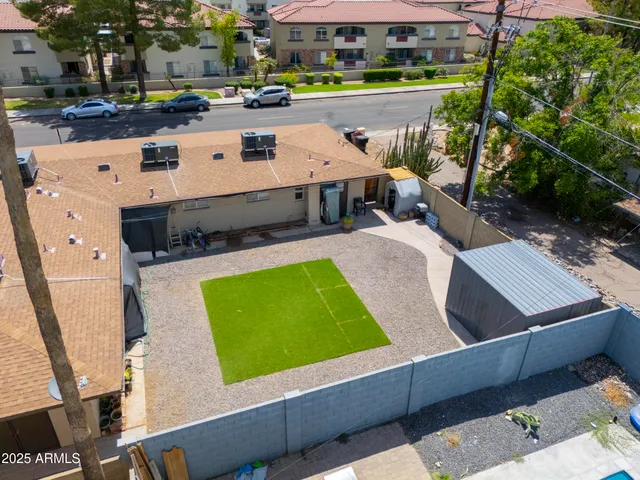 a view of a patio with table and chairs