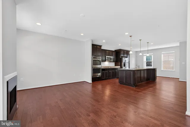 a view of kitchen with wooden floor