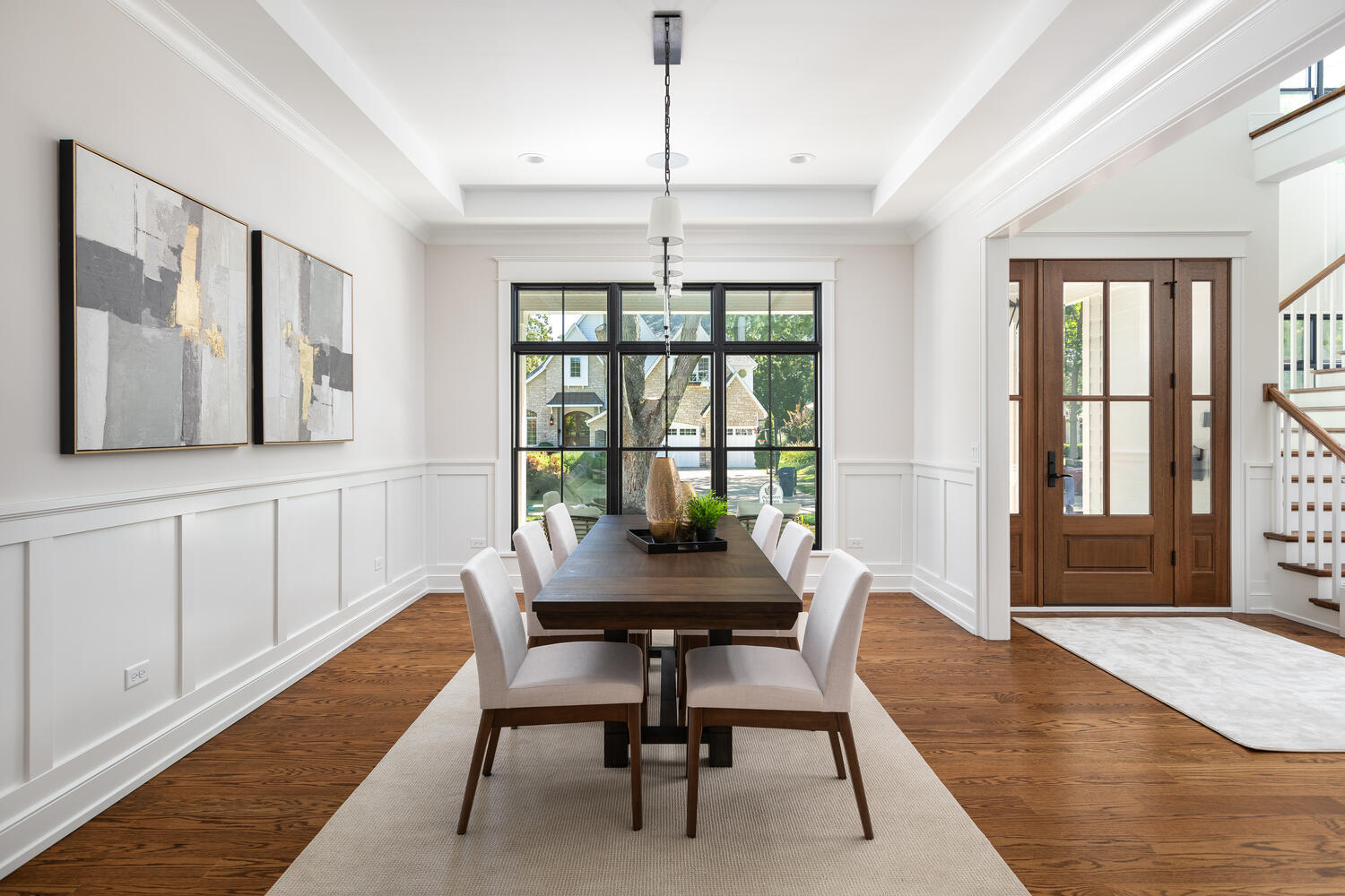 706 South Loomis Street Naperville, IL 60540 - Photo 18 of 43 a dining room with furniture a chandelier and wooden floor