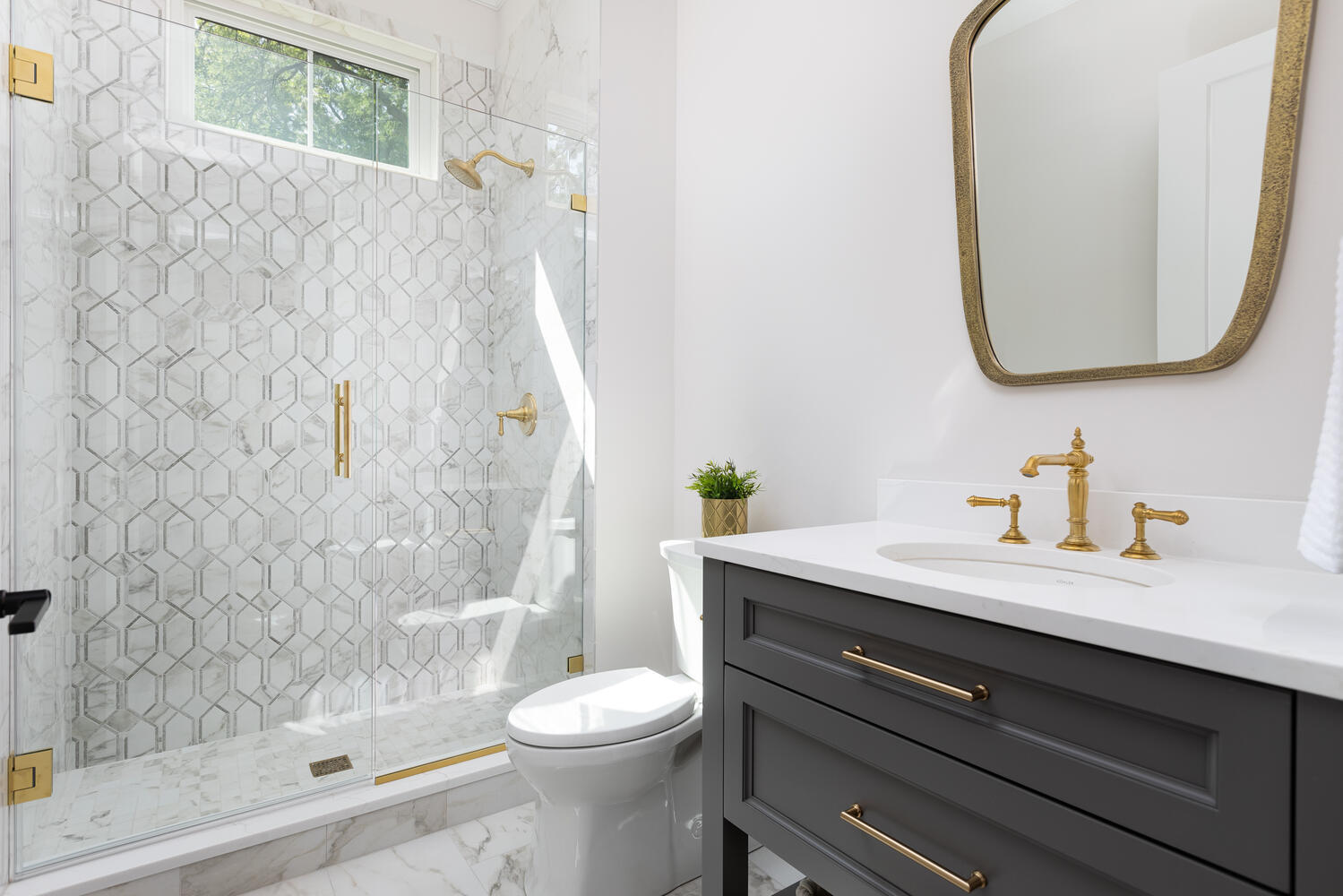 706 South Loomis Street Naperville, IL 60540 - Photo 22 of 43 a bathroom with a sink a toilet and a mirror