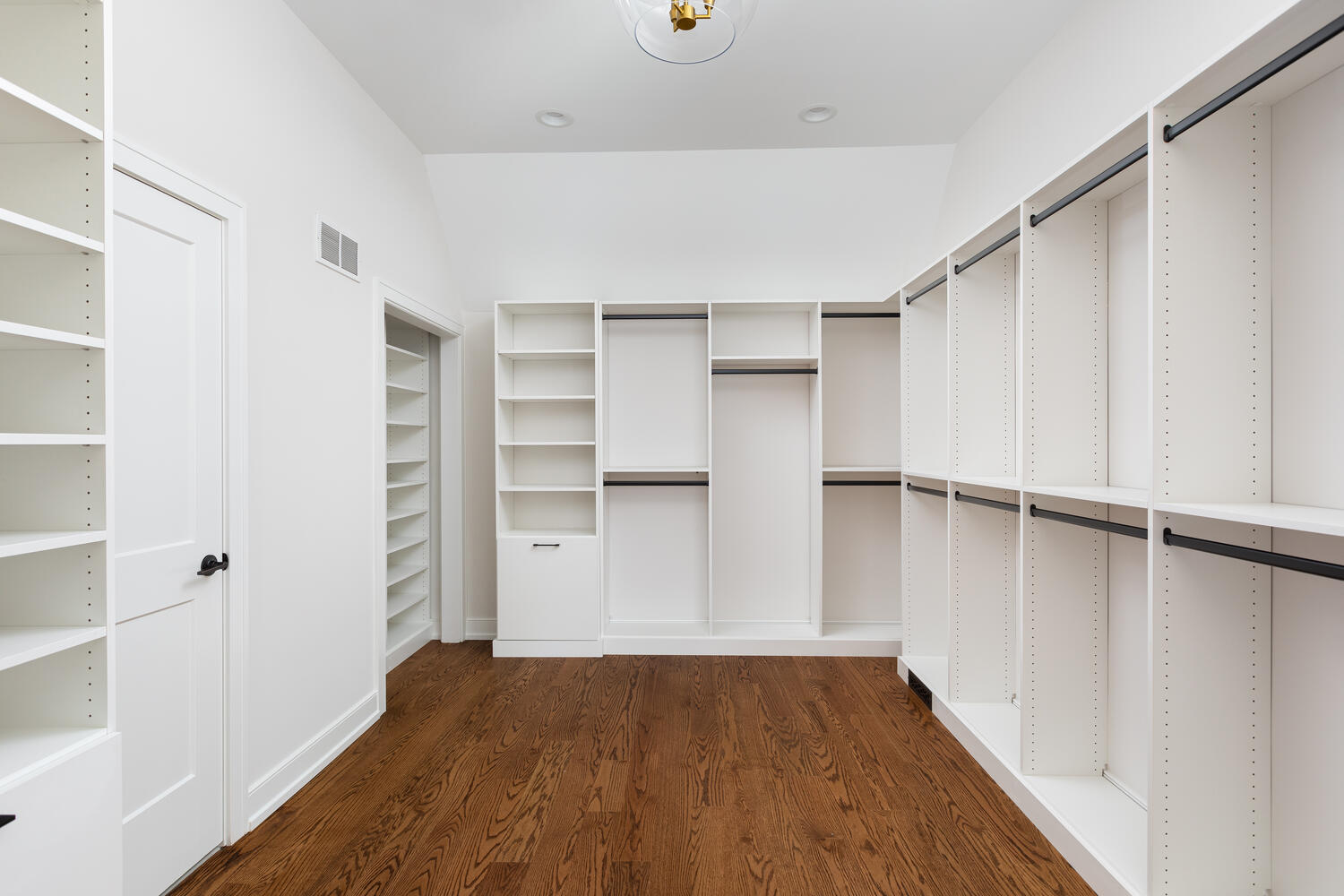 706 South Loomis Street Naperville, IL 60540 - Photo 28 of 43 a view of walk in closet with empty racks