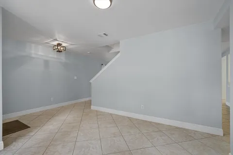 a view of an empty room with windows