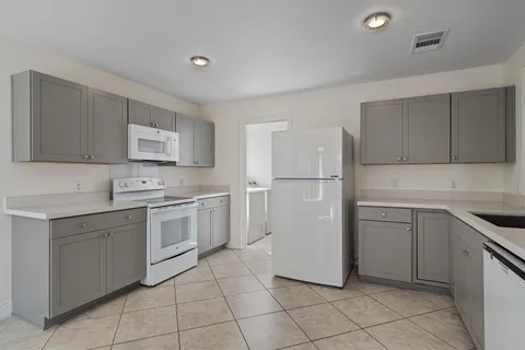 a view with a sink and cabinets
