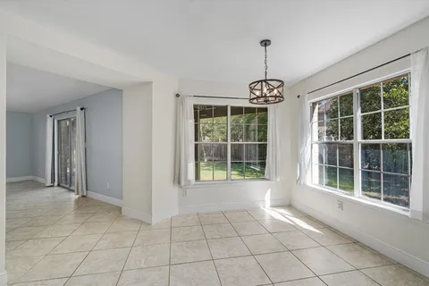 a kitchen with a white stove top oven and refrigerator