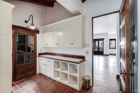 a room with a stove and a sink