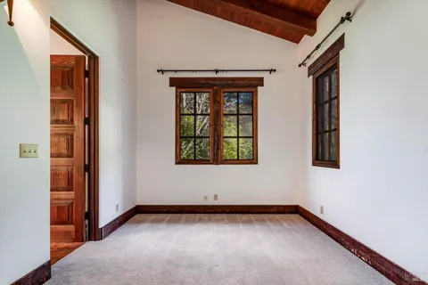 a view of an empty room and windows