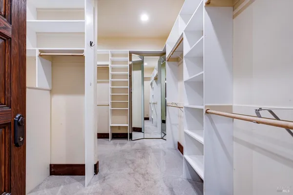a view of an empty room with a bathroom