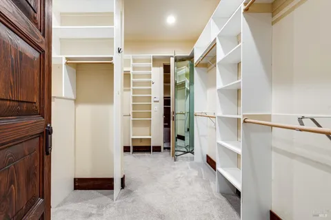a bedroom with a bed and a walk in closet