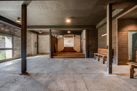 a kitchen with stainless steel appliances granite countertop a refrigerator and a stove