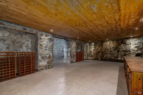 a bathroom with a toilet sink vanity and mirror