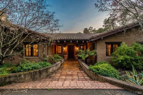 a kitchen with stainless steel appliances a sink and cabinets