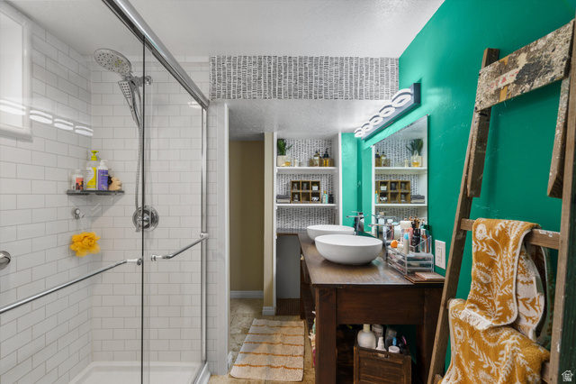 961 33rd Street Ogden, UT 84403 - Photo 25 of 39 Bathroom featuring a walk-in shower with subway tile surround and glass enclosure